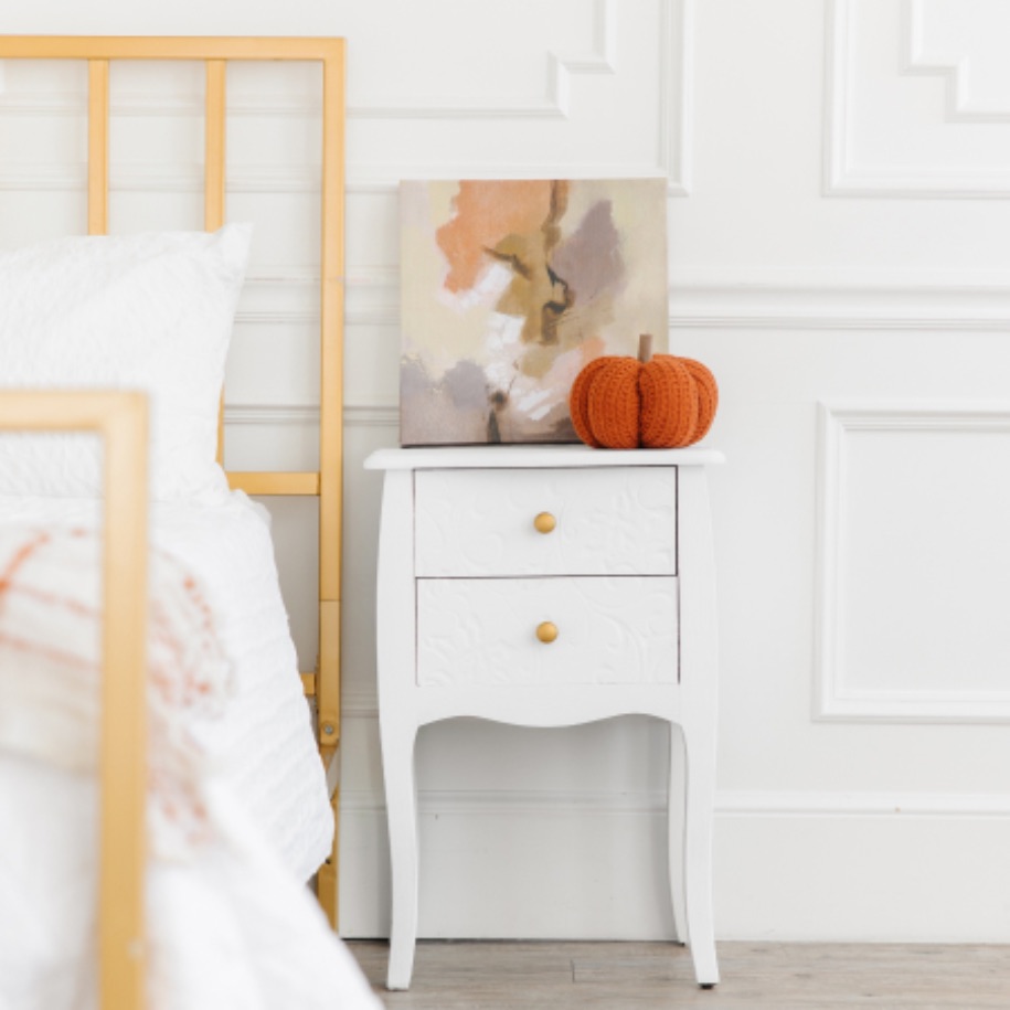 This clean bed and side table is prepped for fall with tips from Zerorez.