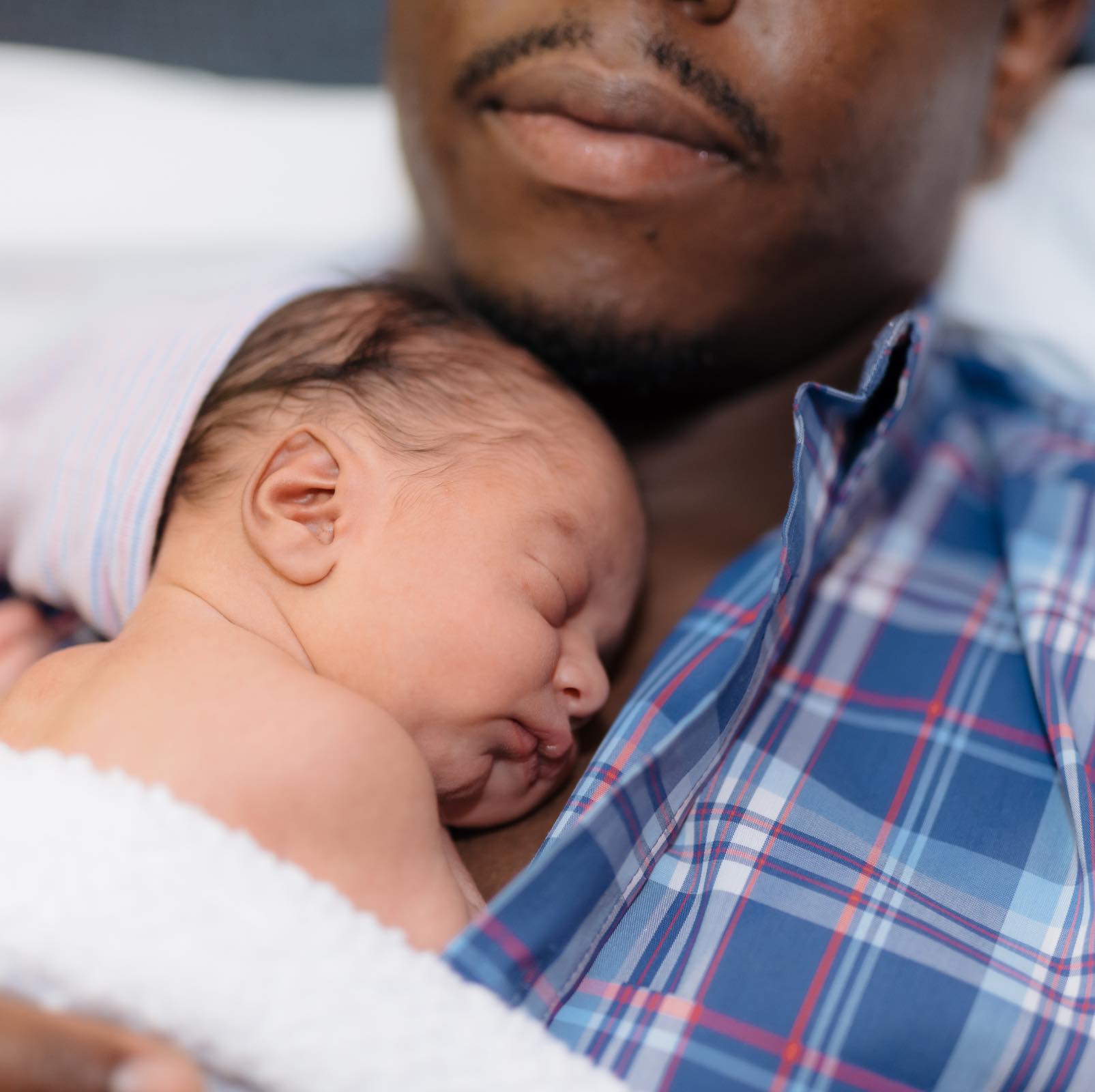 This dad with a newborn baby could appreciate the gift of house cleaning with Zerorez to ease the transition.